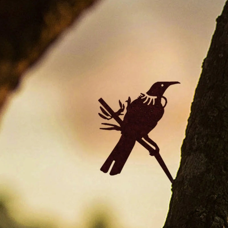 Photo of Metalbird Mini Tui hammered into a tree
