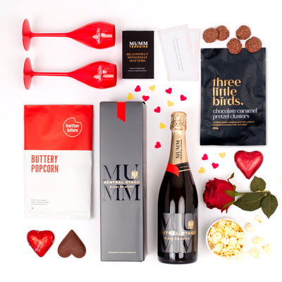 The Valentine's Day Essentials Gift Box featuring Mumm Marlborough Prestige, two polycarb Mumm flutes, and a fun couples quiz game.