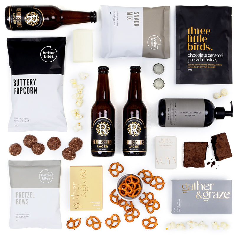 The Dapper Drop Gift Box combines premium self-care and craft beer with a range of irresistible snacks. Featuring The Aromatherapy Co Therapy Man Hand & Body Wash, VEYA Goat’s Milk & Honey Soap, and three bottles of Renaissance Lager, it’s everything he needs to relax, recharge, and indulge.